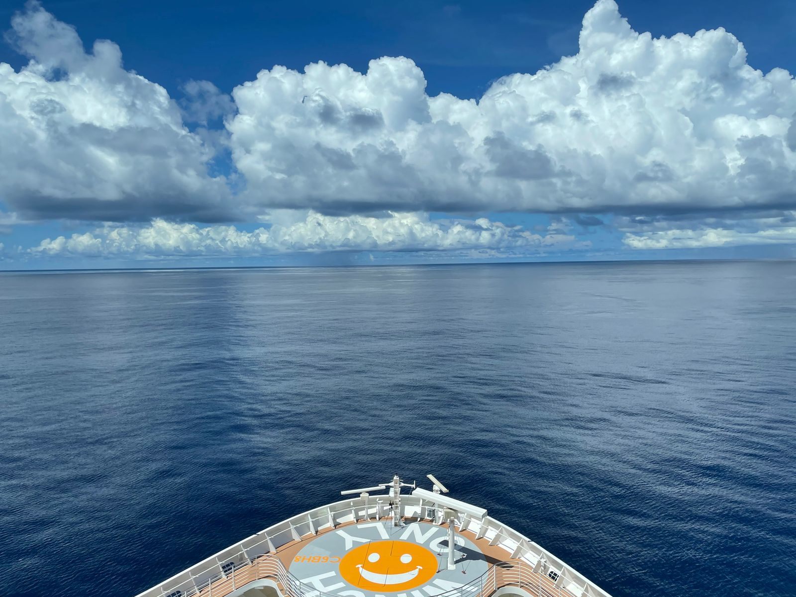 The bow of a cruise ship heading across open ocean, looking ahead to the cheapest cruises 2027 offers